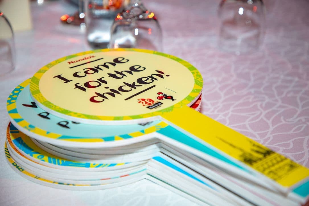 Nando's 'I came for the chicken' branded table paddles